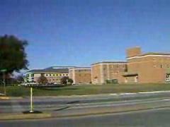 A video showing the town square, the Courthouse-on-the-Square, and University of North Texas campus including water fountains, library and student services center.