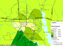 Map diagram showing median family income levels in Denton County. The southern area has a median family income in the $91,630 to $106,016 range. The northern area has a median range between $65,517 and $75,261. Downtown area has the lowest range at $23,828 to $41,453.