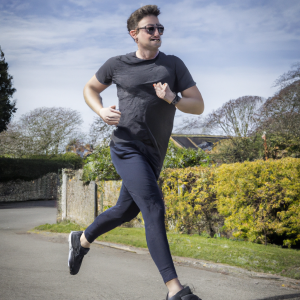 a professional appealing image of a caucasian man or woman jogging on a sunny day 120 300x300