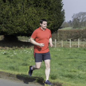 a professional appealing image of a caucasian man or woman jogging on a sunny day 465 300x300